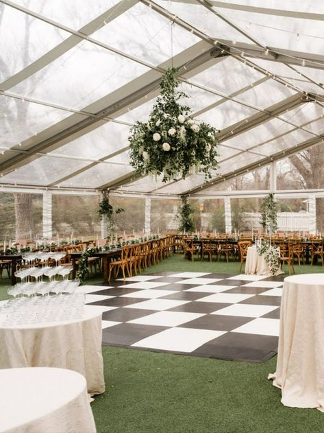 A great way to dress up your wedding tent is to add a floral instilation. It can be above the dance floor or over the head table. There are so many options! Venue: Woodbine Mansion. Photos: The Brothers Martens. Eucalyptus Wedding Tent, All White Tent Wedding, Tennis Court Tent Wedding, Mountain Tent Wedding, Garden Party Wedding Tent, Wedding Tent Outdoor, Wedding Tent Rental, Wedding Reception In Tent, Country Tent Wedding