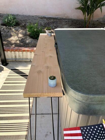 As we head into summer, make yourself an easy and affordable outdoor bar area! Whether its placed against your hot tub like ours, or just an extra space for food and drinks, it will add a custom look to your space! Let's get started! Step 1: Cut your wood to the length of your choosing. After your wood is cut to the length you need, use your electric sander to sand the wood until it is smooth to the touch. Step 2 Decide which side of your wood will be the top, and flip it over so t… Diy Outdoor Hot Tub, Hot Tub Bar, Outdoor Bar Area, Hot Tub Landscaping, Hot Tub Patio, Diy Outdoor Bar, Electric Sander, Hot Tub Deck, Balcony Bar