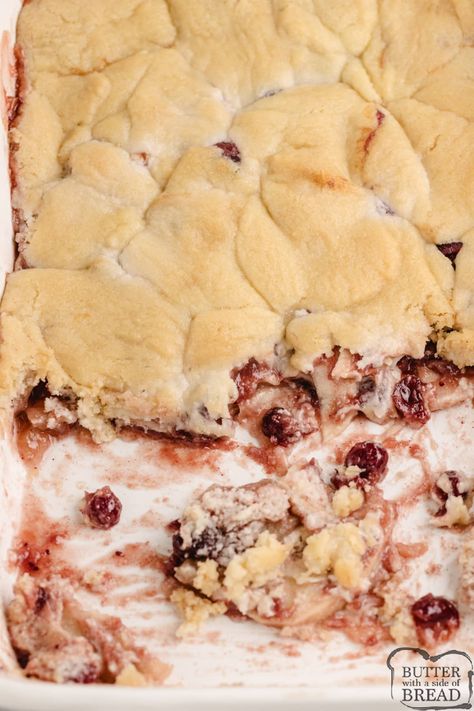 Cranberry Apple Cobbler is made with cranberry sauce, sliced apples, and a sugar cookie crust. This simple 6-ingredient cobbler recipe is the perfect fall dessert! Cranberry Cobbler Recipes, Apple Cranberry Cobbler, Yummy Fall Desserts, Homemade Sugar Cookie Dough, Cranberry Cobbler, Best Apples For Baking, Apple Cobbler Recipe, Sugar Cookie Crust, Sliced Apples