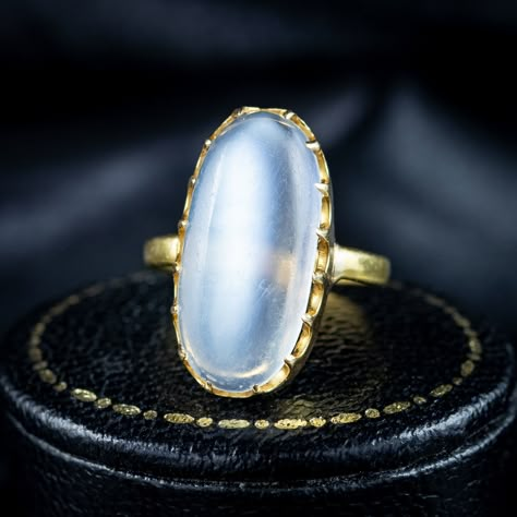 Look at that blue glow! An enchanting antique early Victorian moonstone solitaire ring boasting a magnificent cabochon moonstone, weighing approx. 6 carats. It has a lovely, smooth surface that is semi-transparent and exhibits a bright, silvery-blue schiller that floats across the surface when it catches the light. The moonstone is held securely in an 18ct gold claw mount and features Birmingham hallmarks within the band that have worn over time but appear to date to 1842. It’s a wonderful ... 5 Days Left, Edwardian Engagement Ring, Silvery Blue, Victorian Jewellery, Love Wisdom, Blue Glow, Blue Moonstone, Days Left, Moonstone Jewelry