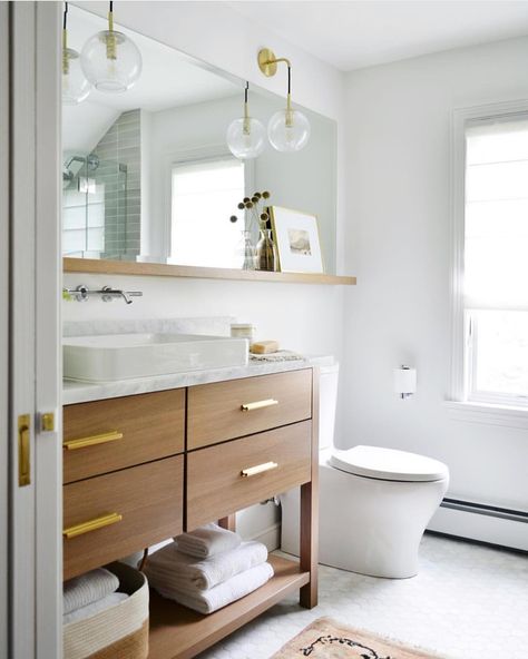 I think this bathroom is so pretty! I love that ledge under the mirror! How unique! Beautiful lighting as well! Designed b Luxury Spa Bathroom, Bathroom Mirror With Shelf, Condo Bathroom, Bilik Air, Bathroom Upgrade, Spa Bathroom, Mirror With Shelf, Upstairs Bathrooms, Bathroom Update