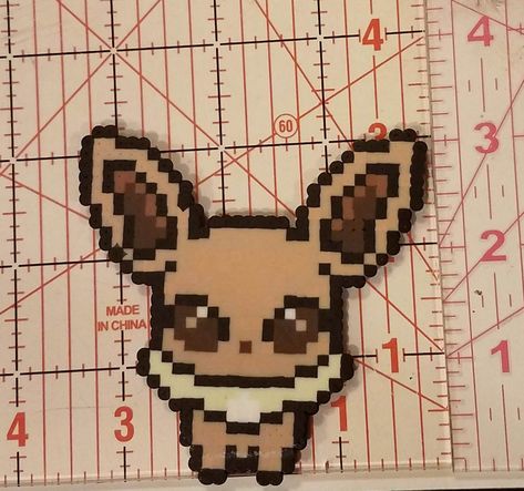 Eevee pokemon made out of perler beads. Pokemon Bead, Perler Creations, Perler Art, Pixel Art Grid, Melting Beads, Pixel Pattern, Bead Ideas, Square Bead, Perler Bead