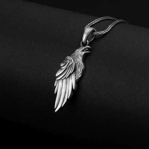 Embrace the mystical allure of this sterling silver raven charm necklace, inspired by Norse mythology and the powerful symbol of Odin's bird. Ravens have long been associated with wisdom, transformation, and protection, making this elegant piece a meaningful addition to your jewelry collection. Expertly crafted with intricate details, this enchanting necklace captures the essence of the raven's mysterious beauty. Whether you're drawn to its spiritual symbolism or simply its striking design, this Norse Raven, Crow Pendant, Raven Jewelry, Mysterious Beauty, Raven Pendant, Raven Necklace, Raven Bird, Gothic Pendant, Tarnished Jewelry