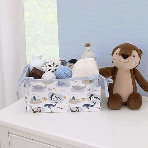 Meet your little one's new cuddle buddy – a soft, snuggly sea otter made for endless hugs and cozy moments! With its sweet embroidered smile and whiskers, this plush friend is ready to join all of baby’s adventures, from story time to naptime. 💙 Perfectly coordinates with our NoJo Arctic Adventure bedding set for a nursery filled with warmth and wonder. 🦦✨ Shop now using the link in bio! #NoJo #winternursery #winternurserydecor #nurserydecor #nurseryinspo #babyroom #nurserydesign #nurseryi... Arctic Nursery Theme, Arctic Nursery, Themed Baby Nursery, Light Blue Trim, Gray Whale, Shades Of Light Blue, Crib Skirt, Bear Nursery, Storage Caddy