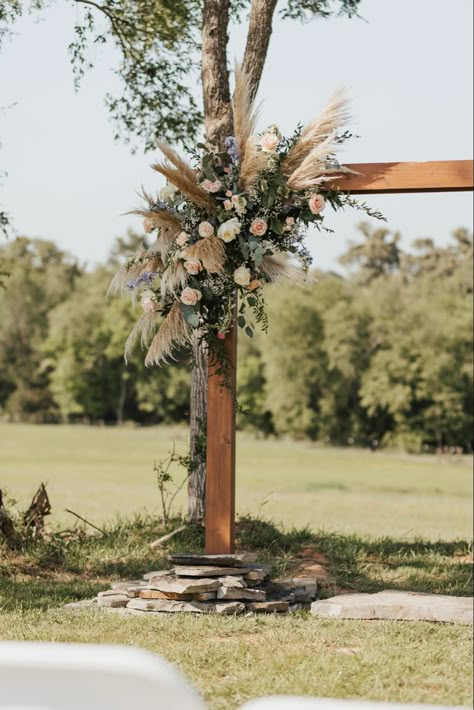 Wooden wedding are with a bohemian style flower arrangement. Flowers On Arch Wedding, Bohemian Wedding Arch, Wooden Wedding Arch, Wood Wedding Arches, Rustic Flower Arrangements, Wooden Wedding Arches, Boho Wedding Arch, Bridal Bouquet Blue, Boho Wedding Bouquet