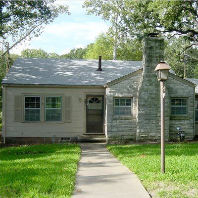 The original plan for this 1940s bungalow served as a solid foundation for dramatic expansion. Adding a second story doubled the home's square footage. On the exterior, wide overhangs, broad windows, and bands of horizontal color give the home an inviting appearance and help it blend with its natural surroundings. Portico On Ranch House, Midcentury Cottage, House With Front Porch, Portico Entry, Front Porch Remodel, Large Shutters, Cottage Remodel, Victorian Porch, Boost Curb Appeal