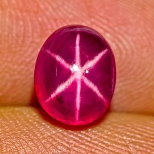 Star Ruby from Burma.  Star rubies and sapphires are not as rare as you may think.  Star rubies and star sapphires are gemstones that exhibit a star-like phenomenon known as asterism. Star gems contain intersecting needle-like inclusions (often the mineral rutile, a mineral composed primarily of comprised of titanium dioxide) that cause the appearance of a six-rayed 'star'-shaped pattern when viewed with a single overhead light source.  To cause a star, the rutile needles form in parallel and... Overhead Light, Lucky Jewelry, Pretty Rocks, Pink Star, Semi Precious Gems, Titanium Dioxide, Star Sapphire, Star Ruby, My Man