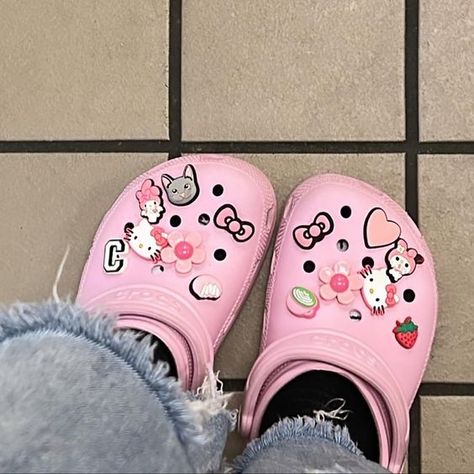 Pink Croc Inspiration, Pink Hello Kitty Crocs, Crocs With Hello Kitty Charms, Pink Apple Headphones, Pink Crocs With Jibbitz, Stucco Crocs, Uggs Sweatpants, Crocs Outfit Summer, Pink Nike Dunks