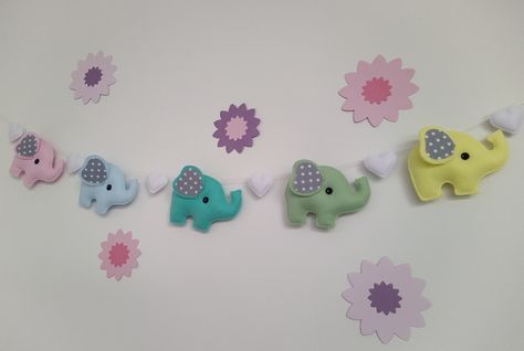 Beautiful pastel nursery garland/ bunting made by hand. These charming elephants were delicately crafted from soft felt and grey spotted fabric. Elephant Garland, Felt Elephant, Nursery Garland, Pastel Nursery, Felt Crafts Diy, White Hearts, Baby Diy, White Heart, Fairy Lights