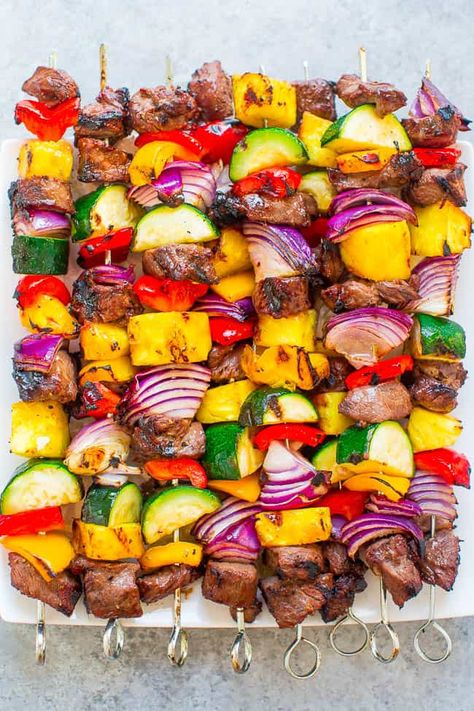 Juicy grilled steak kabobs with sweet bell peppers, onions, zucchini, and pineapple!! Fast, EASY, zero cleanup, and DELISH!! Skewers In The Oven, Veggie Steak, Grilled Steak Kabobs, Grilled Kabob Recipes, Grilling Kabobs, Steak Kabobs, Kabob Skewers, Averie Cooks, Bbq Skewers