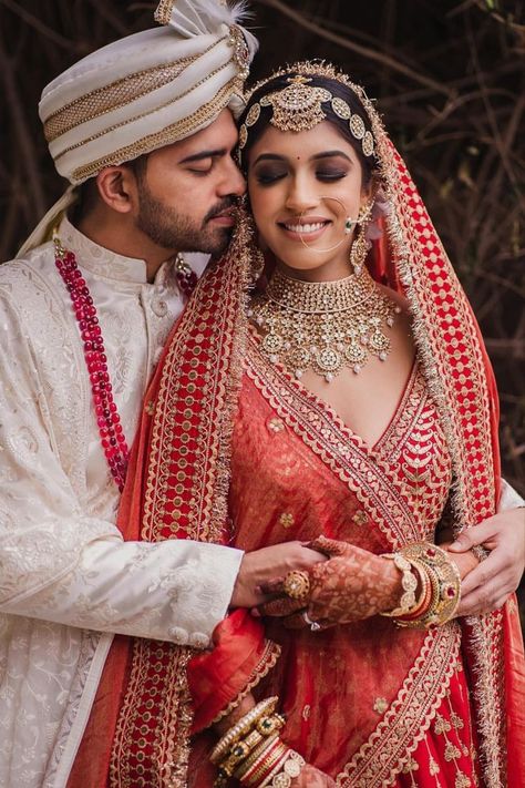 Bride with bold smokey eyes going in sync with her red Sabyasachi wedding look! Bride Groom Photoshoot, Bride Groom Poses, Indian Bride Photography Poses, Indian Wedding Poses, Bride Photos Poses, Groom Photoshoot, Indian Wedding Bride, Bridal Photography Poses, Indian Wedding Couple Photography