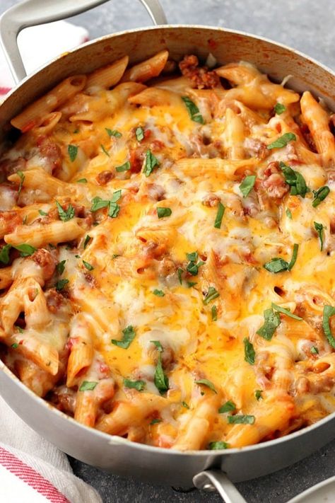 One Pot Cheesy Sausage Penne Recipe - hearty and satisfying one pan pasta dinner. Italian sausage, quick tomato sauce and penne pasta with cheesy topping is perfect for busy weeknights. Meal Ideas With Sausage, Sweet Sausage Pasta Recipes, Andoullie Sausage Recipes, Sausage Recipes For Dinner Easy Meals, Best Pasta Recipes Dinners, Loose Sausage Recipes, Sausage And Pasta Recipes Easy, Dinner Ideas With Sausage, Sausage And Pasta Recipes