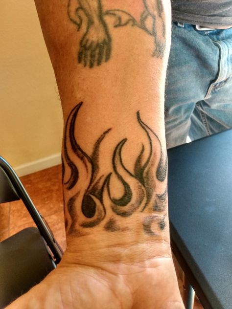 Fire Wrist Tattoos Men, Wrist Filler Tattoo Men, Flames Drawing Tattoo, Red Ink Neck Tattoo Men, Neck Flame Tattoo, Arm Filler Tattoo Ideas Men, Fire Wrist Tattoo, Easy Forearm Tattoos, Flames Neck Tattoo