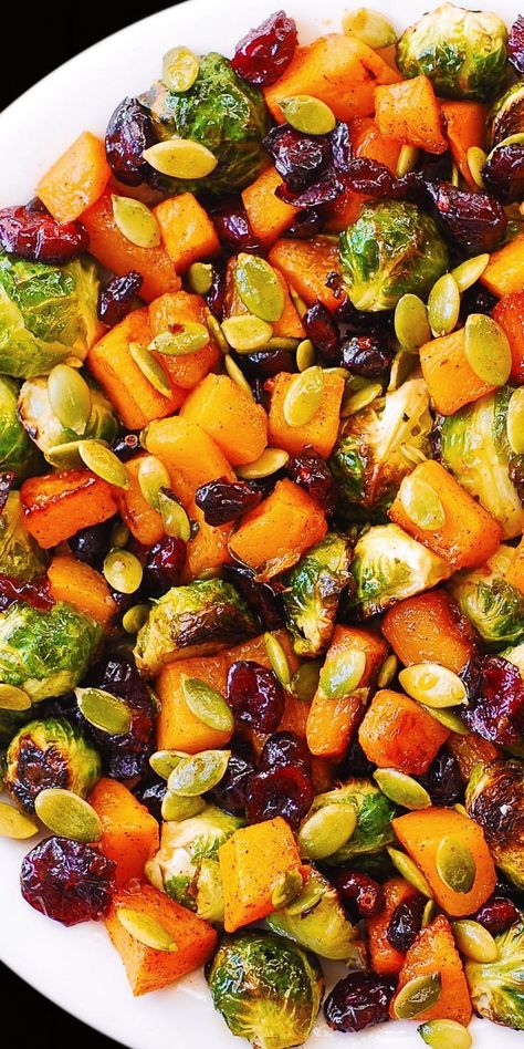 Roasted Brussels Sprouts Salad with Maple Butternut Squash, Pumpkin Seeds, and Cranberries – perfect Autumn salad, bursting with colors and flavors! Holiday side dish for Thanksgiving, Christmas, and New Year’s Eve. Healthy, delicious, gluten free recipe packed with veggies. I love this Brussels sprouts salad so much – to me it looks so much like...Read More Veggies Thanksgiving, Maple Butternut Squash, Resep Vegan, Brussels Sprouts Salad, Resep Salad, Sprouts Salad, Holiday Side, Roasted Brussels Sprouts, Brussel Sprout Salad