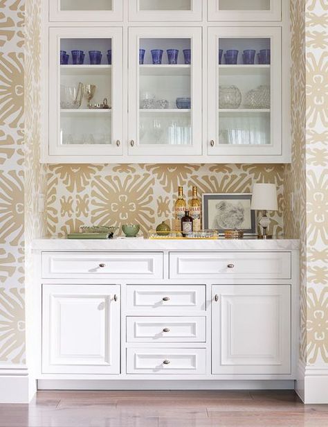 If your home is blessed with a butler's pantry, use it as a bar. Interior designer Heather Hilliard kept this one light, bright, and classic with a printed wallpaper, fresh white paint, and display cabinets. #homebar #homebarideas Butlers Pantry Ideas, Pantry Lighting, Home Bar Ideas, Butler’s Pantry, Devol Kitchens, Home Bar Design, Butlers Pantry, Coffee Bar Home, Home Bar Designs