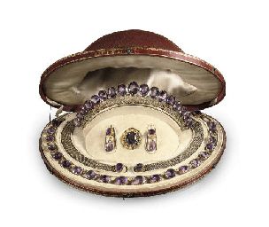 A SUITE OF ANTIQUE AMETHYST JEWELLERY   Comprising: a tiara, a necklace, a pair of bracelets, a brooch and a pair of earrings, all set with oval-cut amethysts within gold foliate and fleur-de-lys decorated mounts, circa 1860, french export mark and maker's mark, in original tooled red leather fitted case Amethyst Parure, Brooch Bracelets, Antique Amethyst Jewelry, Amethyst Jewellery, Matching Necklace And Bracelet, Tiaras Jewellery, Georgian Jewelry, Dutch Royalty, Historical Jewellery