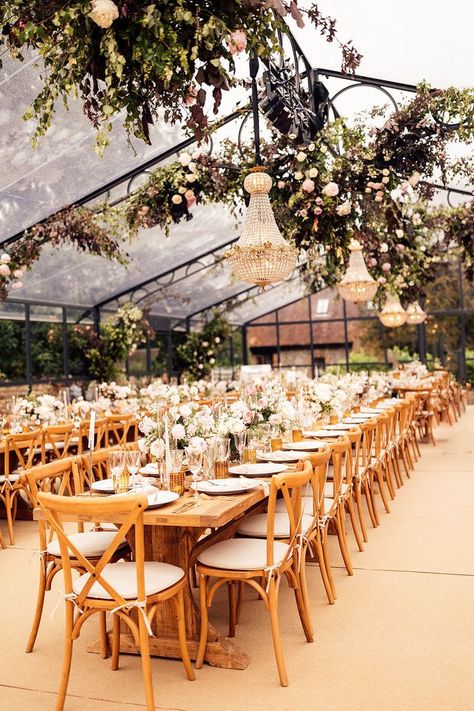 Glass marquee wedding reception with hanging chandeliers, wedding flowers and wooden banquet tables Glass Marquee Wedding, Glass Marquee, Wedding Dresses Destination, Tipi Wedding Decor, Wedding Table Decor Ideas, Dress At Home, English Country Garden Wedding, Marquee Decoration, Garden Marquee