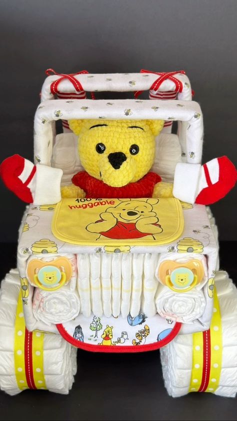 This adorable Winnie the Pooh jeep diaper cake is launching tomorrow, along with lots of other Jeeps! there’s only 1 right now, more… | Instagram How To Make A Diaper Cake For Baby Boy, Pooh Bear Diaper Cake, Diaper Jeep Instructions, Winnie The Pooh Baby Shower Gift Ideas, Winnie The Pooh Gift Basket, Winnie The Pooh Diaper Cake Ideas, Baby Shower Ideas Boy Theme, Gender Reveal Ideas Winnie The Pooh, Creative Diaper Cakes