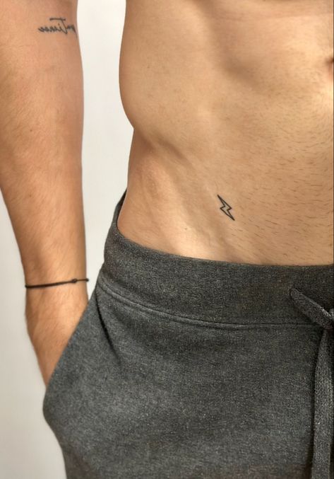 Men’s Small Rib Tattoos, Minimal Tattoos For Men, Meaningful Tattoos For Men, Rib Tattoos For Guys, Lightning Tattoo, Private Tattoos, Minimal Tattoos, Small Chest Tattoos, Simple Tattoos For Guys