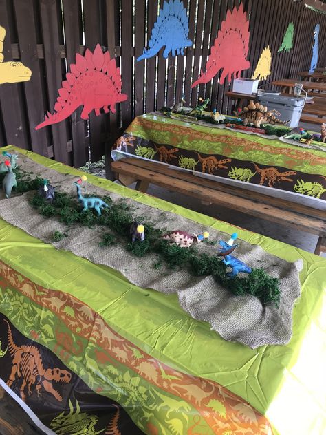 Dinosaur Theme Table Decoration, Dinosaur Table Decor, Dollar Tree Dinosaur, Table Decor Dinosaur Party, Dinosaur Centerpieces, Dinosaur Centerpieces Ideas Dollar Tree, Dinosaur Birthday Table Set Up, Dinosaur Table Centerpiece With Woodstump, Tree Centerpieces For Dinosaur Party