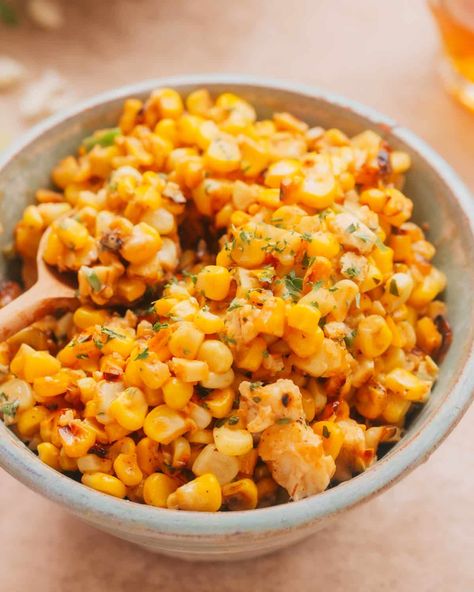 A bowl of Mexican Street Corn Salad (Esquites) garnished with fresh cilantro. Mexican Corn For Tacos, Recipes Using Cotija Cheese, Fish Tacos Sides Dishes, Mexico Corn, Cob Salad, Mexican Street Corn Salad Recipe, Corn Off The Cob, Street Corn Salad, Charred Corn