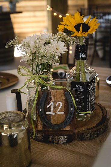 Whiskey Themed Centerpieces, Cowboy Theme Party Centerpieces Table Decorations Western Weddings, Rustic Centerpiece Ideas, Horse Shoes Centerpieces, Horseshoe Centerpieces, Horseshoe Centerpieces Wedding, Western Wedding Gift Table Ideas, Western Bottle Centerpieces, Horse Shoe Table Centerpieces