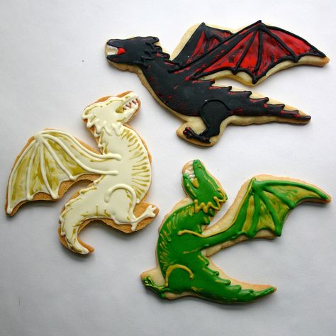 Daenerys' dragons, Drogon, Viserion, and Rhaegal done by Jesicakes.  For more Game of Thrones decorated cookies click through! Game Of Thrones Food, Game Of Thrones Cake, Dragon Cookies, Game Of Thrones Party, Dragon Cakes, Dragon Birthday Parties, Dragon Cake, Game Of Thrones Dragons, Dragon Birthday