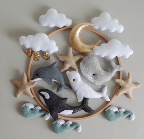 🐋 Baby handmade mobile for boys. The orca mobile with dolphin, beluga, whale, ocean waves and stars.  Wonderful present for the first birthday of your son or even make the ideal baby shower gift. Individual design is possible. Just ask me if you want to change any detail of the mobile for free.  📏 The size.  The diameter of the ring is 25 cm (10 inches). Full length ~ 50 cm (~20 inches). Weight ~ 150 grams 🐋 Different colors are possible. 🐋 Materials Beech ring, half-woolen felt (America, Sp Ocean Felt Mobile, Crib Newborn, Baby Mobile Boy, Hanging Crib Mobile, Whale Mobile, Hanging Crib, Seashell Christmas, Baby Mobile Felt, Whale Nursery