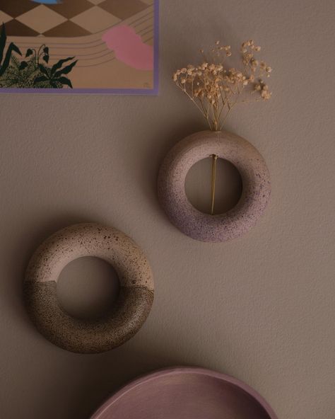 And the last day 7/7. 3 donuts, as a vase or sculpture on the wall. Black vase €20. Small sculpture (Left) and vase (right) 12,50 each. #sculpture #wallsculpture #interiordecorating #decoratingideas #inspiration #vase #handmade #wheelthrown #ceramics #keramiek #ceramica #keramik #ceramicsofinstagram Pottery Donut, Ceramic Donut Vase, Ceramic Donut, Donut Vase, Ceramic Wall Sculpture, Donut Wall, Vase Handmade, Black Vase, Small Sculptures