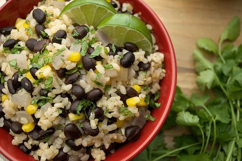 Quick and easy, 30 minute Black Beans and Lime Rice! With a few simple ingredients you’ve got a great week night dinner, and leftovers make for an ideal lunch! The beans are perfectly spiced with cumin, paprika and optional cayenne. The lime rice adds an authentic 'gotta have it taste', and a handful of cilantro completes the bowl! Lime Rice Recipes, Black Beans And Rice, Vegan Mexican Recipes, Burrito Bowls, Lime Rice, Vegan Recipes Healthy, Limes, Black Bean, Vegan Eating