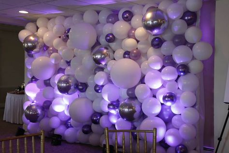 Balloon Sculptures - Organic Balloon Wall Backdrop with Purple & Silver Balloons & LED Uplighting for Bat Mitzvah at the Davenport Club - party decor inspiration - Entering the ballroom, our light up, colorful balloon sculptures are guaranteed to enliven your guest’s eyes. They are designed to create a unique experience for your party guests. Purple Party Backdrops, Purple And Silver Birthday Party Decor, Club Party Decorations, Purple Decorations Party, Balloon Wall Backdrop, Led Uplighting, Balloon Walls, Purple Party Decorations, Silver Balloons