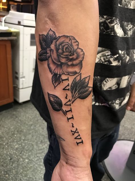 Roman numeral Rose tattoo Rose Tattoo Roman Numerals, Roses And Roman Numerals Tattoo, Roman Numeral With Rose Tattoo, Roman Numeral Rose Tattoo, Roman Numerals Tattoos Men, Roman Numeral Tattoo Men Arm, Rose Roman Numeral Tattoo, Forearm Tattoos Roman Numerals, Rose With Roman Numerals Tattoo