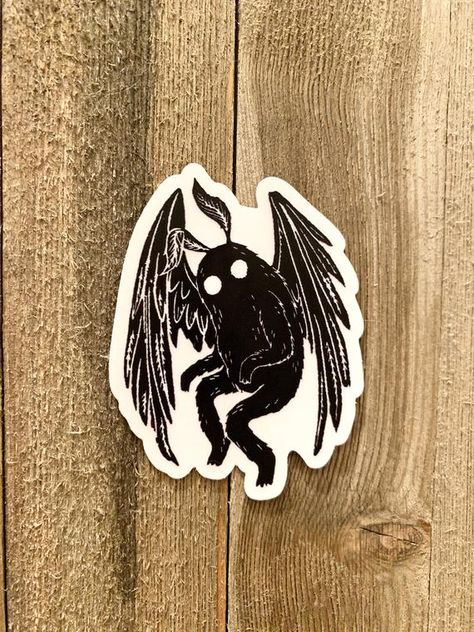 Mothman Cryptid Clear Vinyl Sticker | Etsy Cryptid List, Cryptid Tattoos, Cryptid Tattoo, Mothman Tattoo, Cryptids Art, Mothman Cryptid, Climbing Helmets, Clear Vinyl Stickers, Witch Tattoo