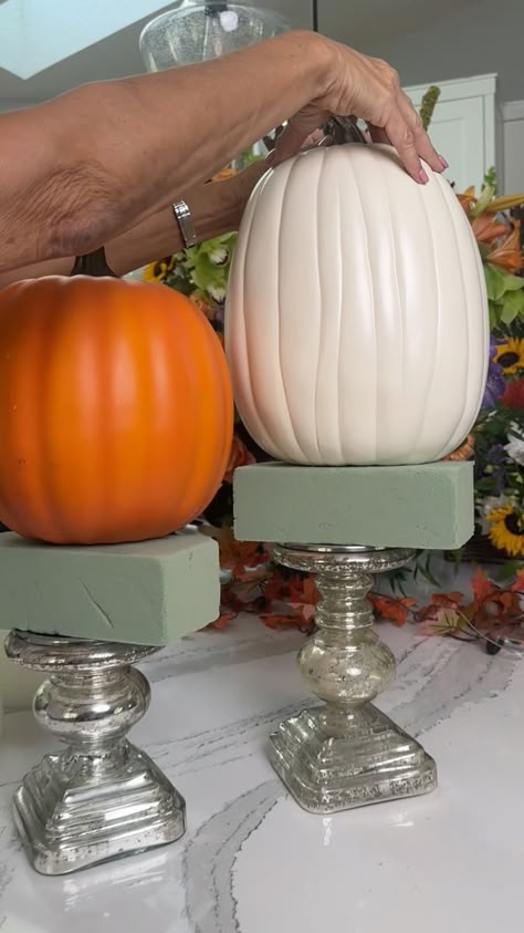 fall decor hack using candlesticks!🎃 | interior design | fall decor hack using candlesticks!🎃 Get creative with your candlesticks and make them a eye catching centerpiece for your fall decor. | By Janelle & Kate | Facebook Diy Fall Floral Decor, Decorating With Candlesticks Ideas, Candlestick Pumpkin Decor, Pumpkin Pedestal, Halloween Candlesticks Diy, Yardstick Fall Centerpiece, Pumpkins On Candlesticks, Fall Candlestick Arrangements, Fall Candlestick Decor