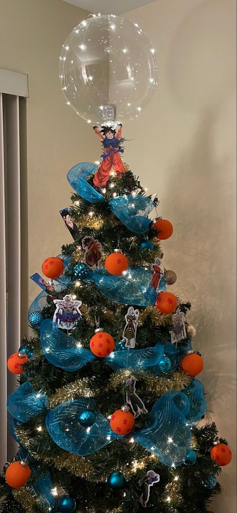 Dragon ball Z themed christmas tree Dragon Ball Tree, Dbz Christmas Tree, Anime Christmas Tree Ideas, Dragon Ball Christmas Tree, Dragon Ball Z Decor, Sonic The Hedgehog Christmas Tree, Studio Ghibli Christmas Tree, Dragon Ball Z Decorations, Dragon Ball Z Christmas Tree