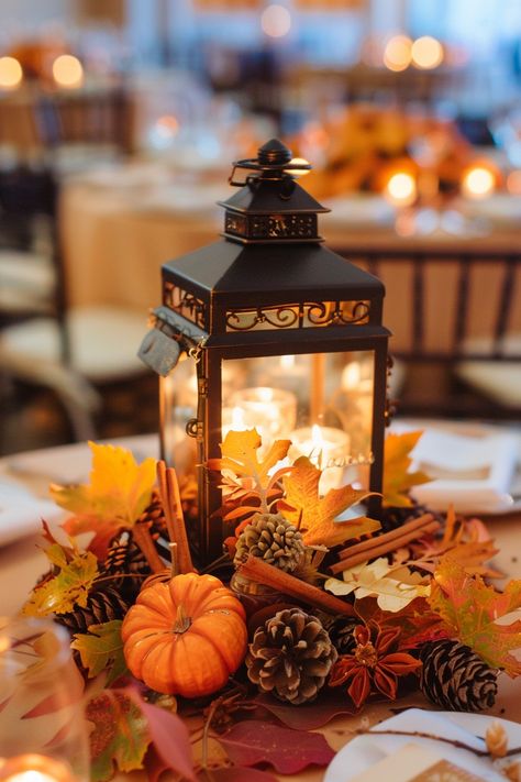 Capture the essence of fall 🍂 with a warm lantern centerpiece for your wedding. Add a romantic touch to your special day with the scent of cinnamon and sweet orange clove decor. Perfect for those seeking a charming autumn vibe! 🕯️🍁 #FallWedding #WeddingInspiration #RusticDecor #AutumnVibes #WeddingIdeas #LanternCenterpiece #CinnamonDecor #OrangeClove Small November Wedding, Wedding Table Centerpieces Autumn, Outdoor Fall Wedding Ideas October Decor, Autumn Wedding Decorations October, Wedding Pumpkin Centerpiece, Autumn Wedding Centrepiece, Wedding In Autumn, Rustic Fall Wedding Table Decor, Fall Table Centerpieces Wedding