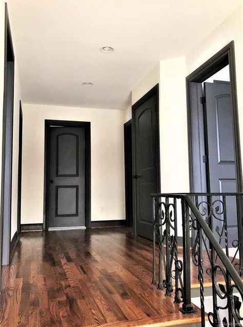 Grey Floors Black Trim, Black Stained Trim Interior, Dark Trim And Light Walls, Light Walls Black Trim, Black Trim Inside House, Black Trim Interior Living Rooms, Dark Trim Interior, Black Moldings And Trim, Interior Black Trim