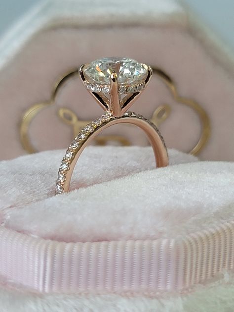 A classic & brilliant choice of a ring! This gorgeous and elegant 2.54 carats engagement ring has a 2 carat lab grown round brilliant cut center diamond and is IGI certified at "F" in color and "VS1" in clarity, (Excellent Cut, Polish and Symmetry) and is set in a classy hidden halo setting all in a 14k rose gold setting with micropaved side stones as well. The ring can also be made in white/yellow gold or platinum and can even be redesigned to your choice. Comes with EGI certification and our l 2 Carat Round Cut Diamond Ring, Brilliant Diamond Engagement Ring, Round Brilliant Cut Diamond Ring, Rose Gold Engagement Ring Round Diamond, Rose Gold Round Halo Engagement Ring, Engagement Rings With Halo Underneath, 2 Carrot Round Diamond Ring, Round Diamond Ring Gold Band, Round Diamond Hidden Halo