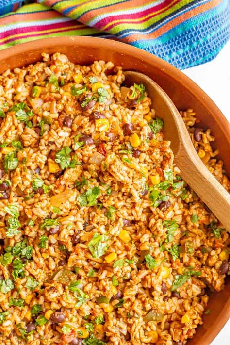 Mexican fried rice is a fun twist on fried rice and a delicious all-in-one dinner with ground turkey, onions and peppers, black beans and corn, salsa and rice. Dinner With Ground Turkey, Fried Rice Video, Mexican Fried Rice, Mexican Fries, Rice Video, Hot Salsa, Food On The Table, Rice And Beans, Corn Salsa