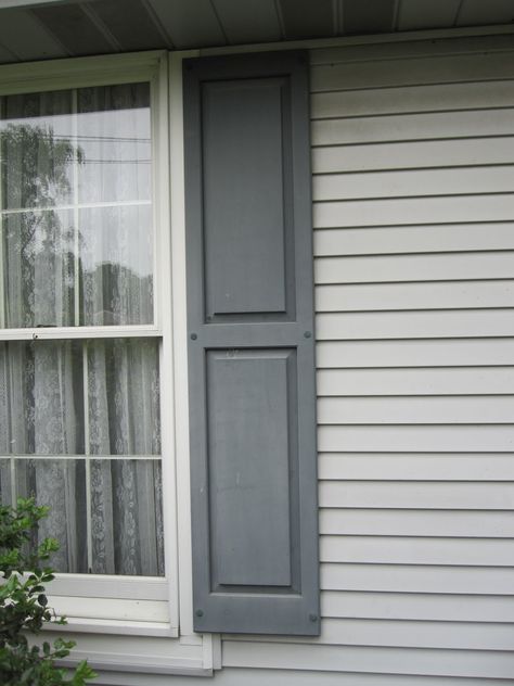 Shutters On Light Gray House, Shutters For Gray House, Grey Shutters Tan House, White House Dark Gray Shutters, Grey House Shutters, Light Gray House Shutter Color, Light Grey House Shutter Color Ideas, Light Gray Siding Exterior With Shutters, Gray Siding With Shutters