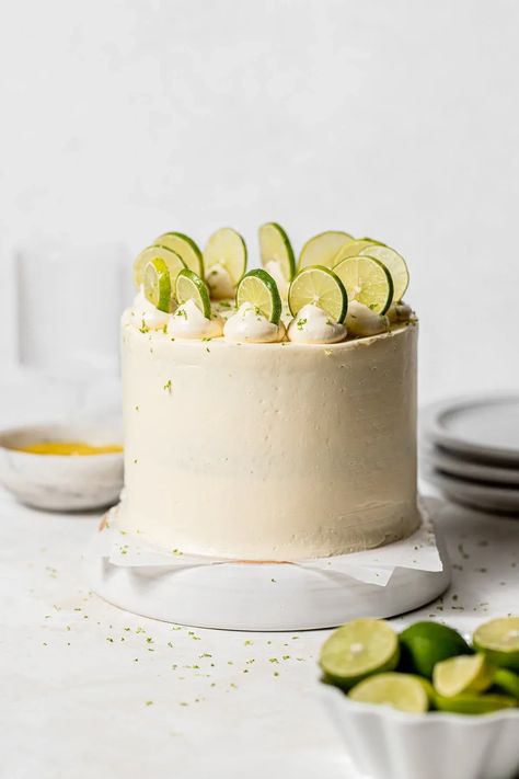 Spring is in the air, and with it comes bright & zesty flavors, like the ones in this key lime cake! The moist white cake layers are filled with a sweet & tart key lime curd and enrobed in a silky swiss meringue buttercream. Each bite is a citrus lover's dream! Lime Cake Recipe, Cake Decorating Tips And Tricks, Cakes With Fruit, Layers Cake, Moist White Cake, Key Lime Cake, Orange Pound Cake, Cake Flavours, Lime Desserts