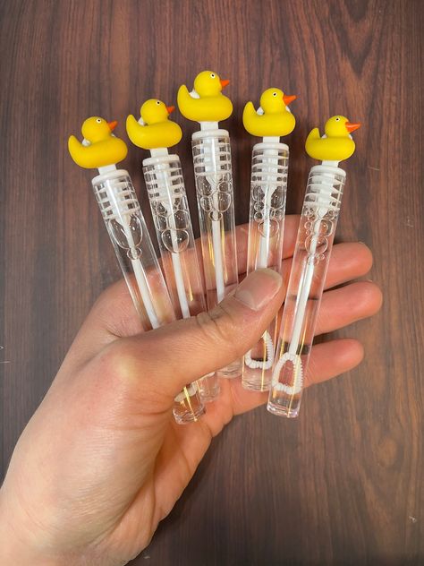 Rubber Ducky favors come in sets of 5 - If you need an amount that is not a multiple of 5, or more than the amounts shown, just message me and I will create a custom link for you to order them!  The ducks are plastic embellishments that are about 1/4 of an inch thick. Bubble Container Size: .14 FL ounces each; 4 inches high (including circular top) x .5 inches wide The bubble containers are made of PLASTIC. * This ships through USPS with a tracking number. Express Shipping Options Available at Checkout for the 48 Contiguous United States. *A rush fee will be added to any order that must be created within 24 hours of ordering and a shipping fee will be added, because the "free standard shipping for orders over $35" no longer applies  Other duck themed items like appetizer skewers, cupcake t Rubber Duck Graduation Party, Rubber Duck Themed Baby Shower Ideas, Rubber Duck Decorating Ideas, Rubber Duck Themed Birthday Party, Rubber Duck Baby Shower Ideas, Rubber Ducky Baby Shower Ideas, Rubber Ducky Birthday Party, Rubber Duck Birthday Party Ideas, Ducky Nursery