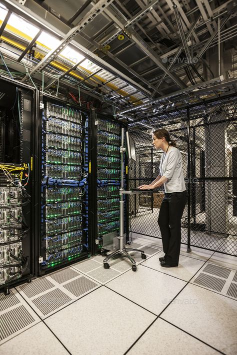 Caucasian woman technician working on computer servers in a server farm. by Mint_Images. Caucasian woman technician working on computer servers in a server farm. #Sponsored #technician, #working, #Caucasian, #woman Server Farm, Working On Computer, Computer Server, Design Trends, Computer, Mint, Quick Saves