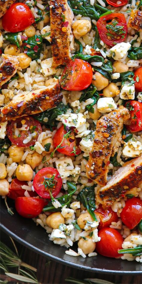 Greek Chicken with Lemon Rice, Chickpeas, Spinach, Grape Tomatoes, and Feta Cheese. 30 Minute One-Pan Meal.  It's healthy, gluten-free, protein-rich, and fiber-rich, and can be easily made dairy-free. Chicken With Lemon, Mediterranean Recipes Healthy, Mediterranean Diet Recipes Dinners, Easy Mediterranean Diet Recipes, Lemon Rice, Greek Chicken, High Protein Meals, Protein Meals, Health Dinner Recipes