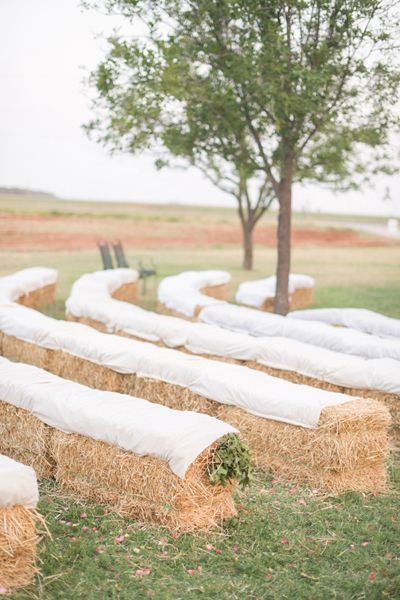 Wedding season is here and today I’m sharing some of my very favorite Country Wedding Ideas. These are not just affordable wedding decorations but super cute ideas that you can do yourself. I can’t wait for you to see them all! Here they are! Sunflowers and Burlap Chair Decor at Love My Dress So easy and pretty! … Hay Bale Seating, Affordable Wedding Decorations, Wedding Ceremony Seating, Wedding Setup, Camo Wedding, Ceremony Seating, Hay Bales, Outdoor Wedding Decorations, Southern Weddings