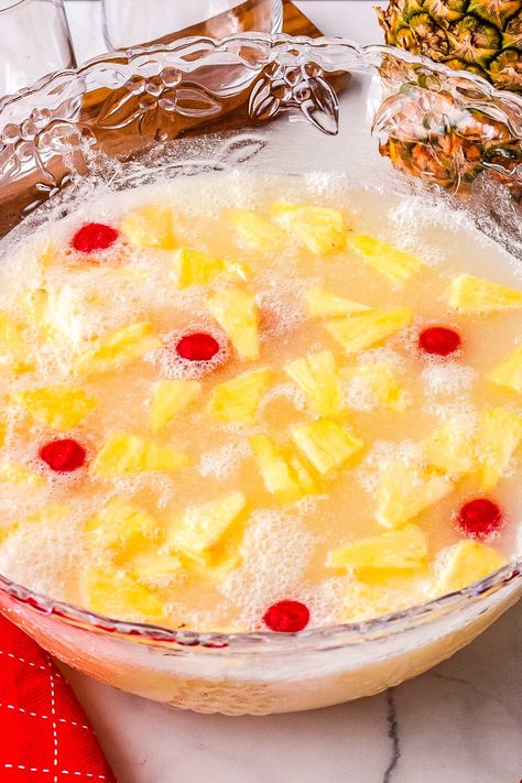 This non-alcoholic Pina Colada Punch is a refreshing tropical drink perfect for year-round parties! With just three ingredients, this easy recipe is ready in 10 minutes and serves 12. Cafe Rio Pulled Pork, Pina Colada Punch Recipe, Pina Colada Punch, Non Alcoholic Margarita, Pina Colada Mocktail, Margarita Punch, Non Alcoholic Punch, Coconut Sorbet, Alcoholic Punch