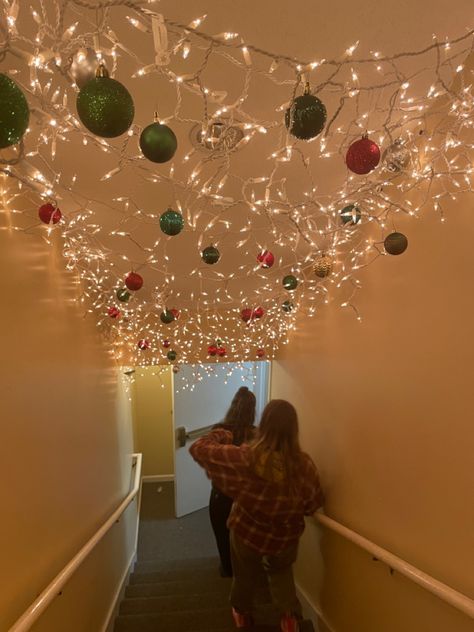 Christmas Light On Ceiling, Christmas Light Ceiling, Interior Christmas Light Ideas, Christmas Decor For Hallway, Christmas Ceiling Lights, Ornaments On Ceiling, Stairwell Christmas Decor, Christmas Stairwell, Christmas Decor Ceiling