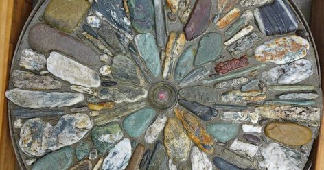 A stepping stone made from beautiful rocks collected from rivers and lakeshores on the south island of New Zealand My stepping stone... Patio Mosaic, Cement Ideas, Moon Window, Mosaic Stepping Stone, Stepping Stones Diy, Mosaic Stepping Stones, Mosaic Garden Art, Garden Stepping Stones, Pebble Mosaic