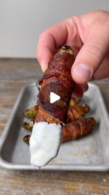 Nick Nesgoda on Instagram: "Smoked Bacon Wrapped Pickles These are so easy to make and they’re super delicious! You can find the full recipe on my website, link in bio • Wrap pickles in bacon then season with Pork Perfect from @fireandsmokesociety • Smoke them at 350F on the using cherry wood • Make homemade ranch: 3/4 cup mayo, 1/2 cup sour cream, 1/2 cup chicken broth, 1 tsp apple cider vinegar, 1 tsp each: dill, garlic powder, onion powder, 1/2 tsp each salt and pepper • Remove pickles once crispy and dip in the homemade ranch . . #bbq #bacon #pickles #ranch #delicious" Bacon Pickles, Bacon Wrapped Pickles, Wrapped Pickles, Barbecue Rub, Garlic Ranch, Bbq Bacon, Homemade Ranch, Smoker Recipes, Smoked Bacon