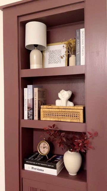 Kelsey Mackall | DIY & Real Life Reno on Instagram: "The hidden bookcase is done!!! It’s not my usual color palette but this cozy color stole my heart. Must be the September mood! Now I have to finish the rest of the hallway. 🤪 -Color: New London Burgundy- #hallwayinspo #bookcasestyling #murphydoor #diydoor #diyhomeprojects #bookcasedecor #hiddendoor #newlondonburgundy #redbookcase #maroonpaint #burgandy #shelfstyling" Burgundy Bookshelves, Red Bookcase, Hidden Bookcase, Pink Bookshelves, September Mood, Styling A Bookcase, Murphy Door, Traditional Eclectic, Bookcase Diy